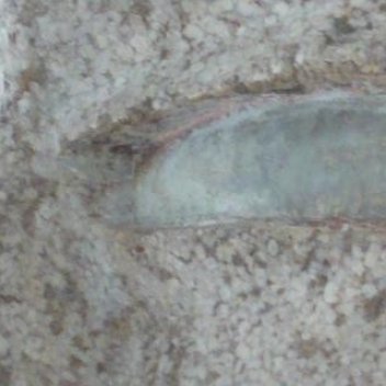 Ossip Zadkine, Tête de femme, détail, 1924, pierre calcaire, incrustation de marbre gris et rehauts de couleur (c) Musée Zadkine / ADAGP - Photo V. Koehler